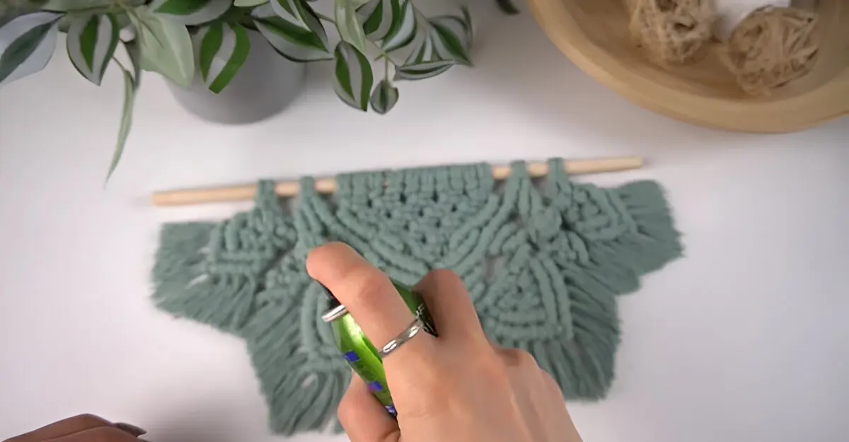 green macrame wall hanging cleaning